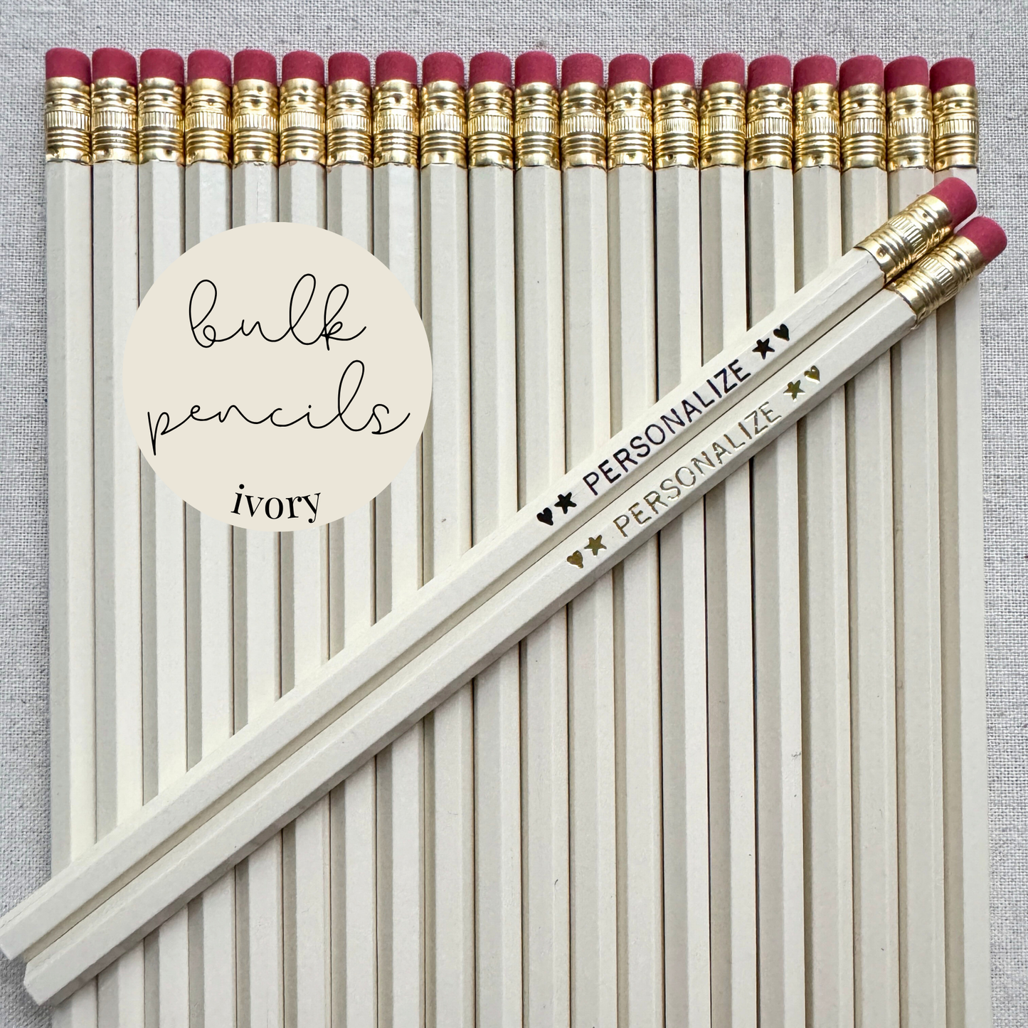 Ivory bulk personalized pencils flat lay in a box with custom text hand-pressed made in the USA for schools events and corporate orders
