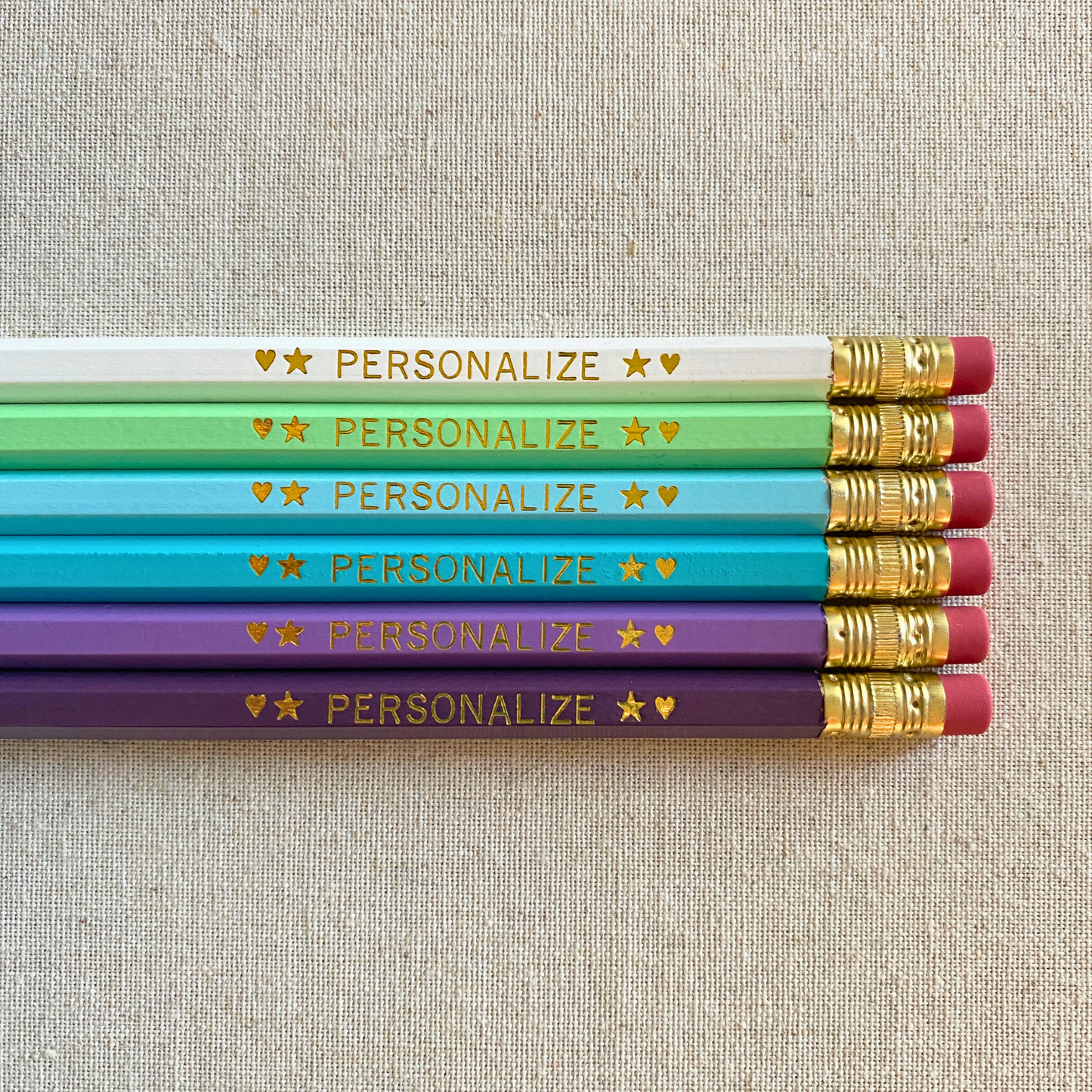 6 Personalized Pencils. White, Pastel Green, Pastel Blue, Aqua, Lilac, Light Purple. Customize with a name or a phrase.