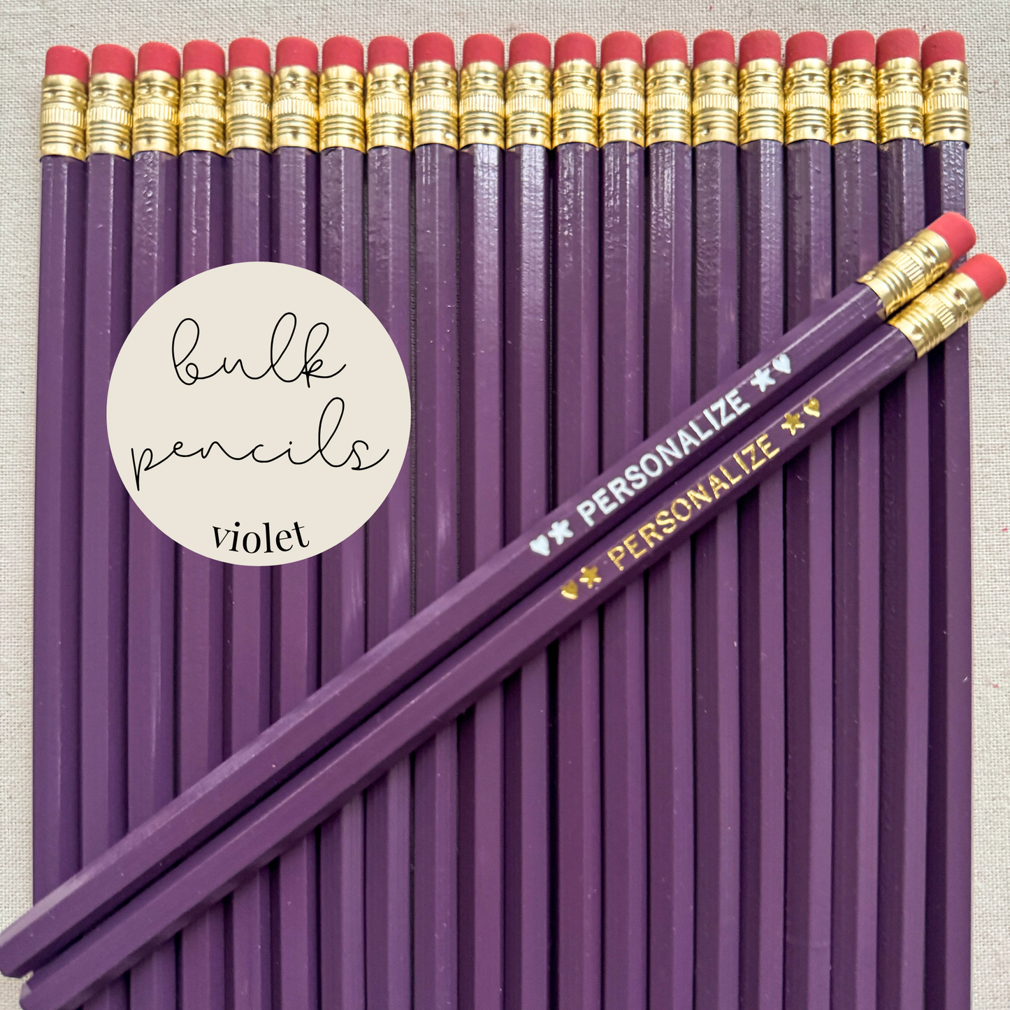 Violet bulk personalized pencils flat lay in a box with custom text hand-pressed made in the USA for schools events and corporate orders
