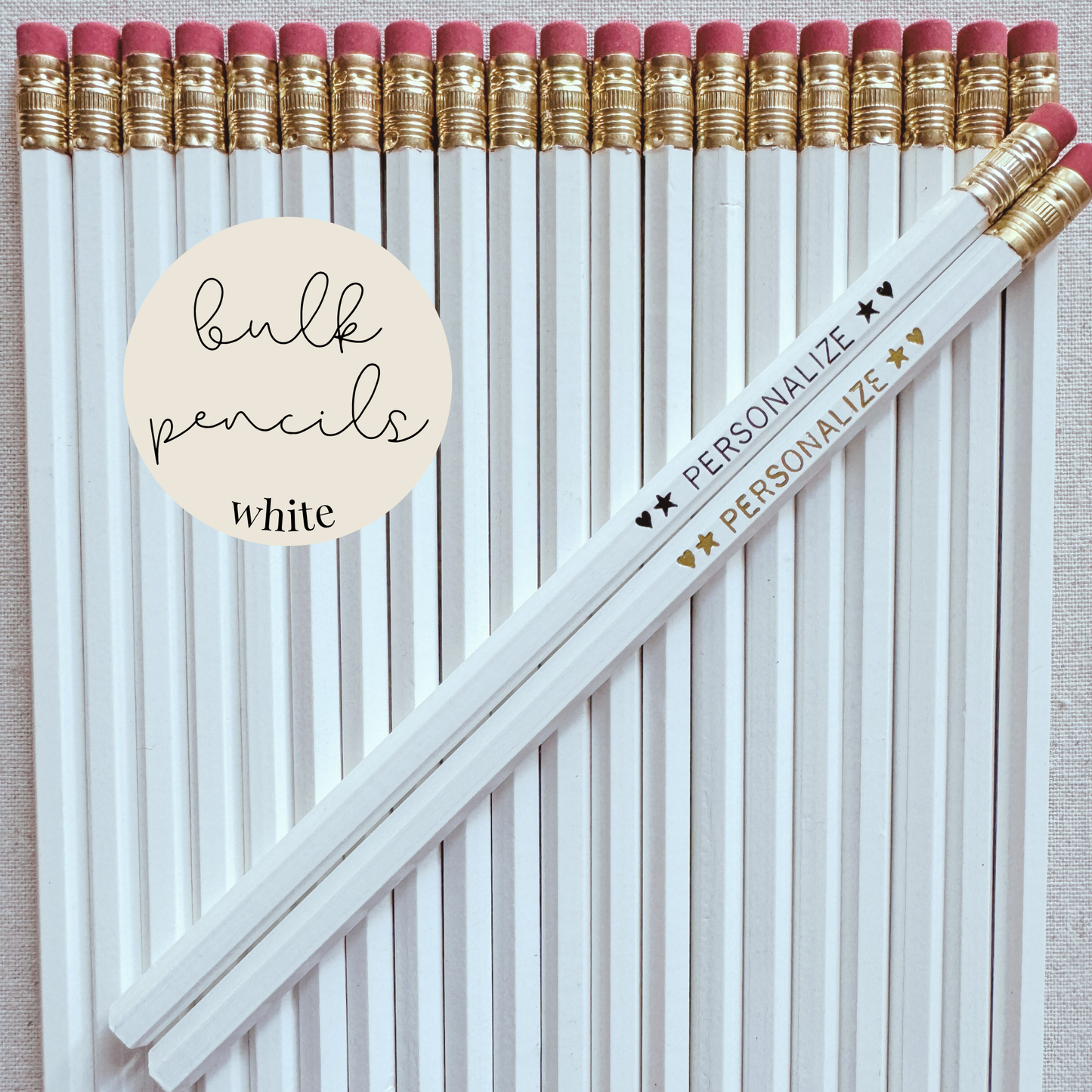 White bulk personalized pencils flat lay in a box with custom text hand-pressed made in the USA for schools events and corporate orders