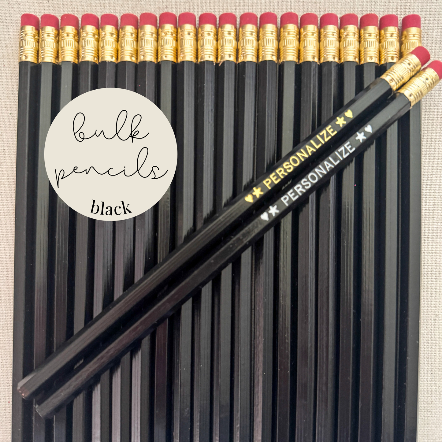 Black bulk personalized pencils flat lay in a box with custom text hand-pressed made in the USA for schools events and corporate orders