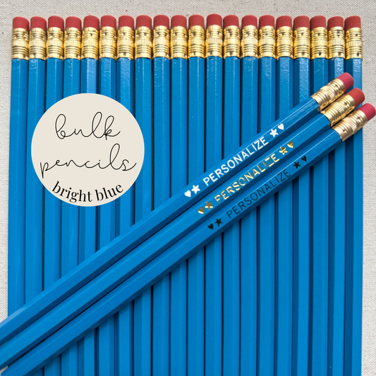 Bright blue bulk personalized pencils flat lay in a box with custom text hand-pressed made in the USA for schools events and corporate orders
