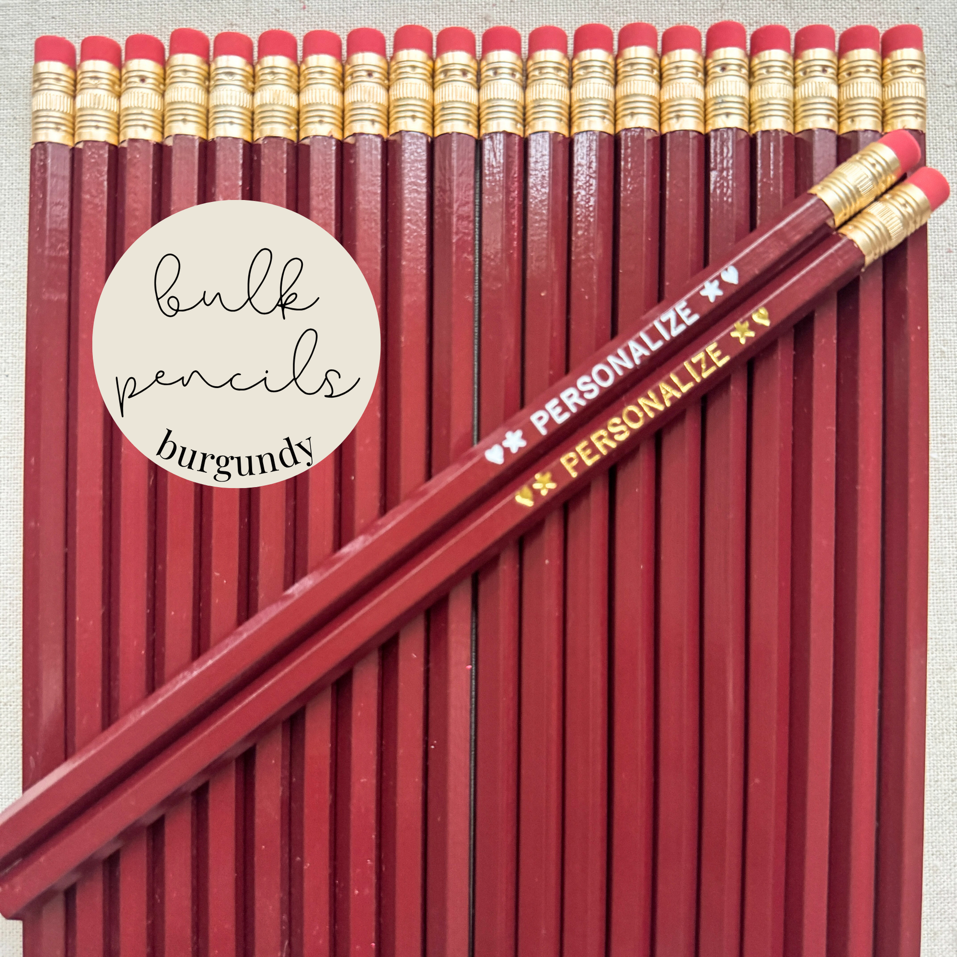 Burgundy bulk personalized pencils flat lay in a box with custom text hand-pressed made in the USA for schools events and corporate orders