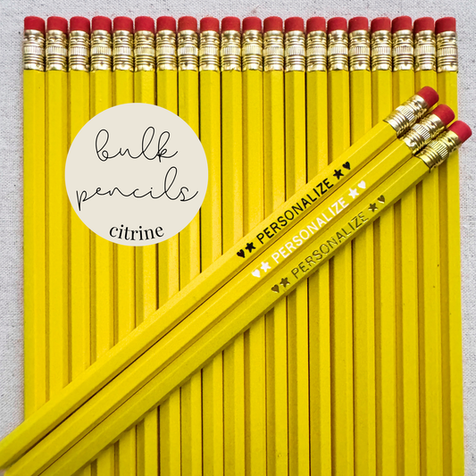 Citrine yellow bulk personalized pencils flat lay in a box with custom text hand-pressed made in the USA for schools events and corporate orders