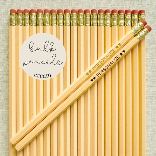 Cream bulk personalized pencils flat lay in a box with custom text hand-pressed made in the USA for schools events and corporate orders