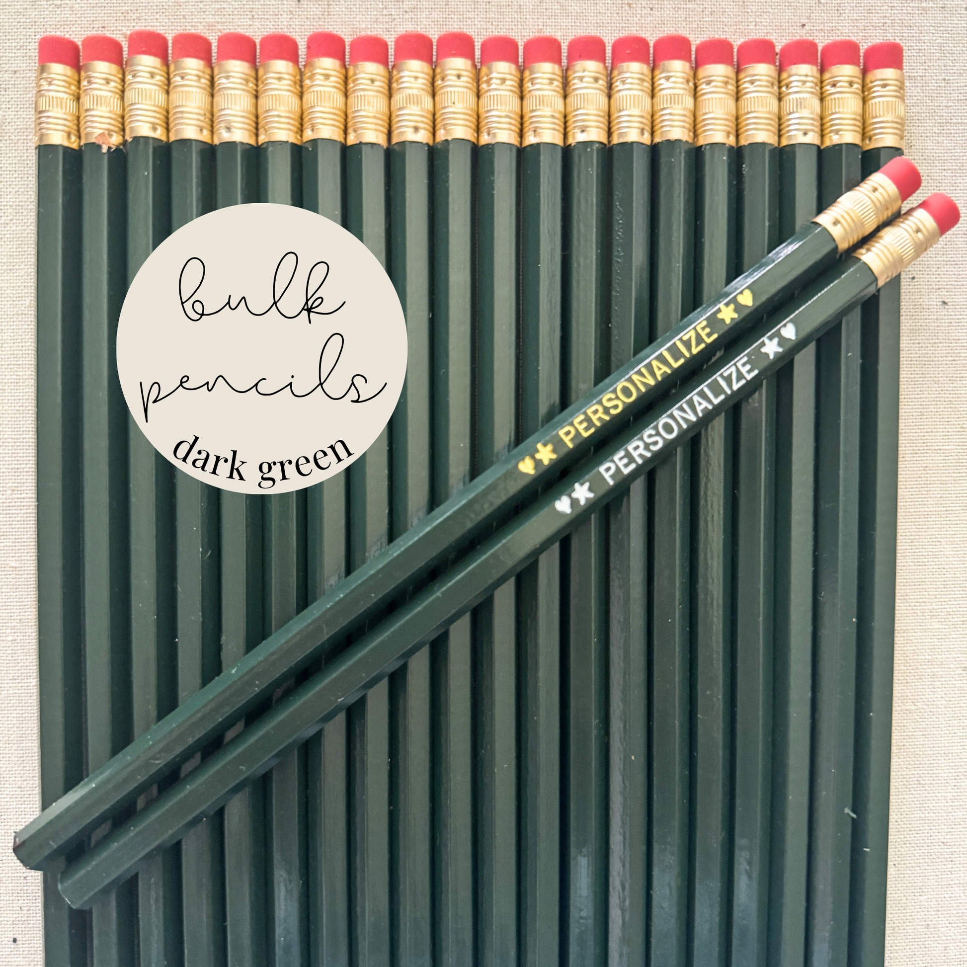 Dark green bulk personalized pencils flat lay in a box with custom text hand-pressed made in the USA for schools events and corporate orders