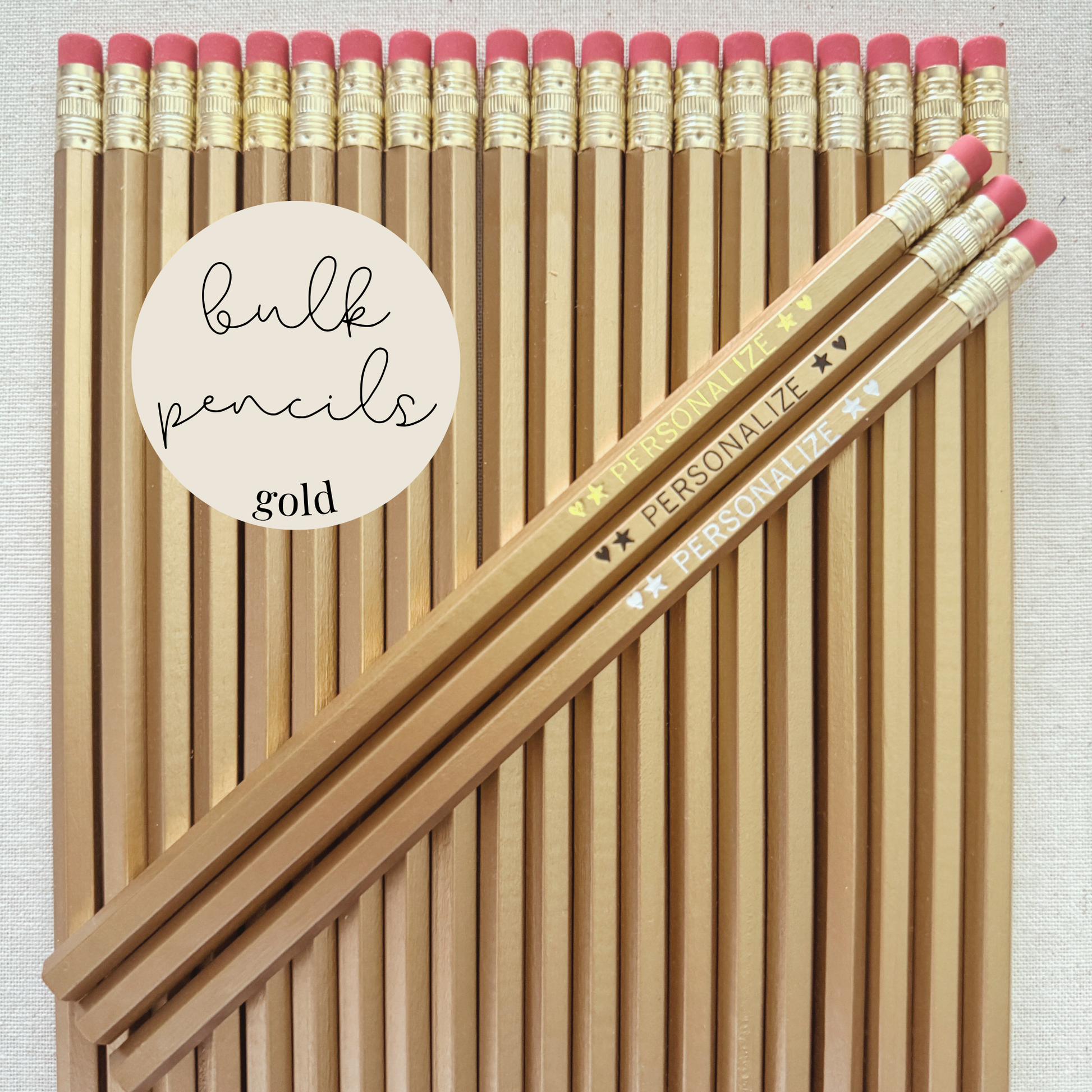 Gold bulk personalized pencils flat lay in a box with custom text hand-pressed made in the USA for schools events and corporate orders