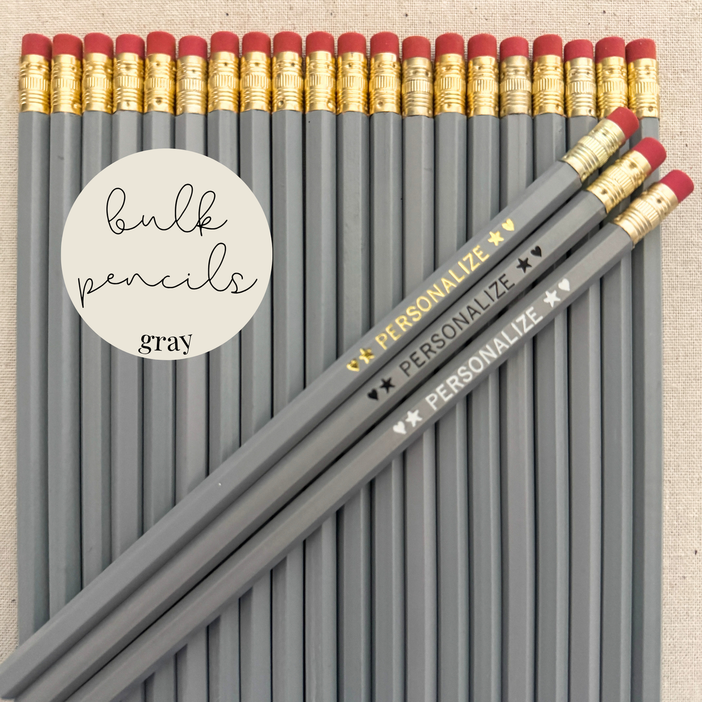 Gray bulk personalized pencils flat lay in a box with custom text hand-pressed made in the USA for schools events and corporate orders