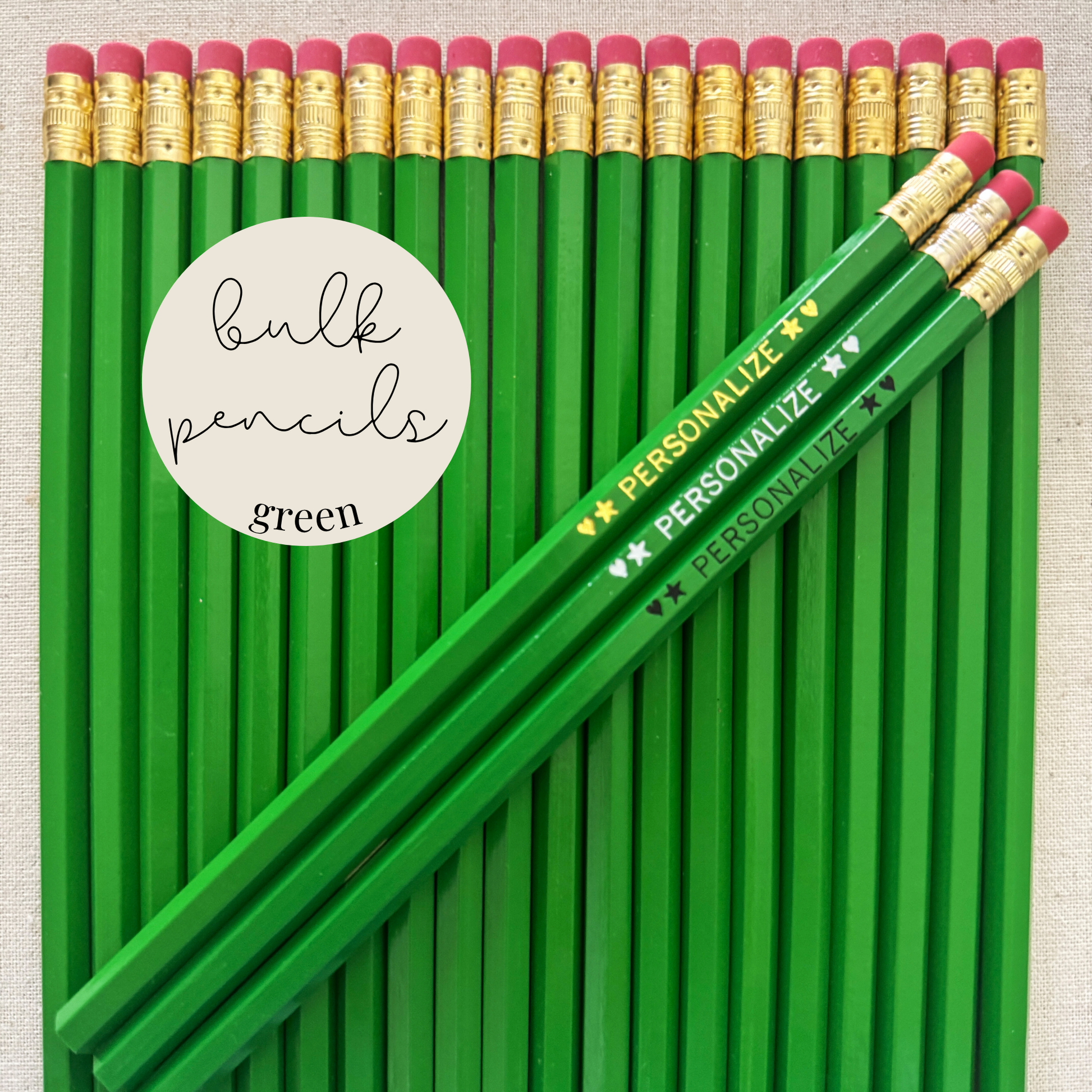 Green bulk personalized pencils flat lay in a box with custom text hand-pressed made in the USA for schools events and corporate orders