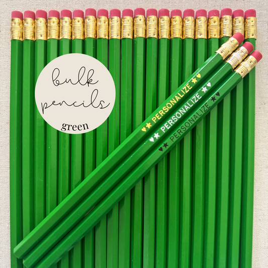 Green bulk personalized pencils flat lay in a box with custom text hand-pressed made in the USA for schools events and corporate orders