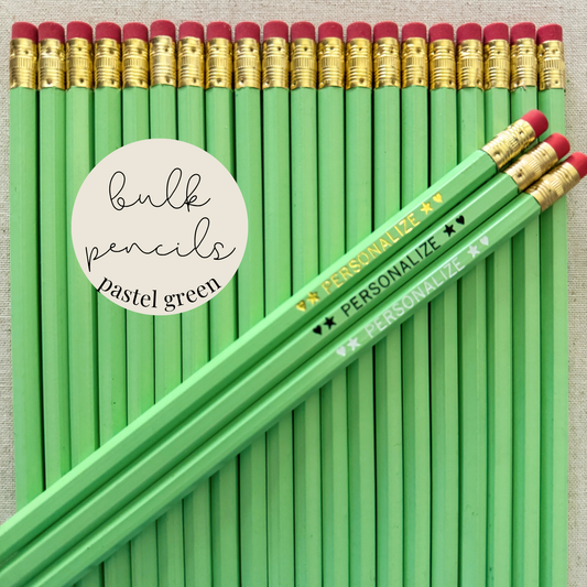 Pastel green bulk personalized pencils flat lay in a box with custom text hand-pressed made in the USA for schools events and corporate orders