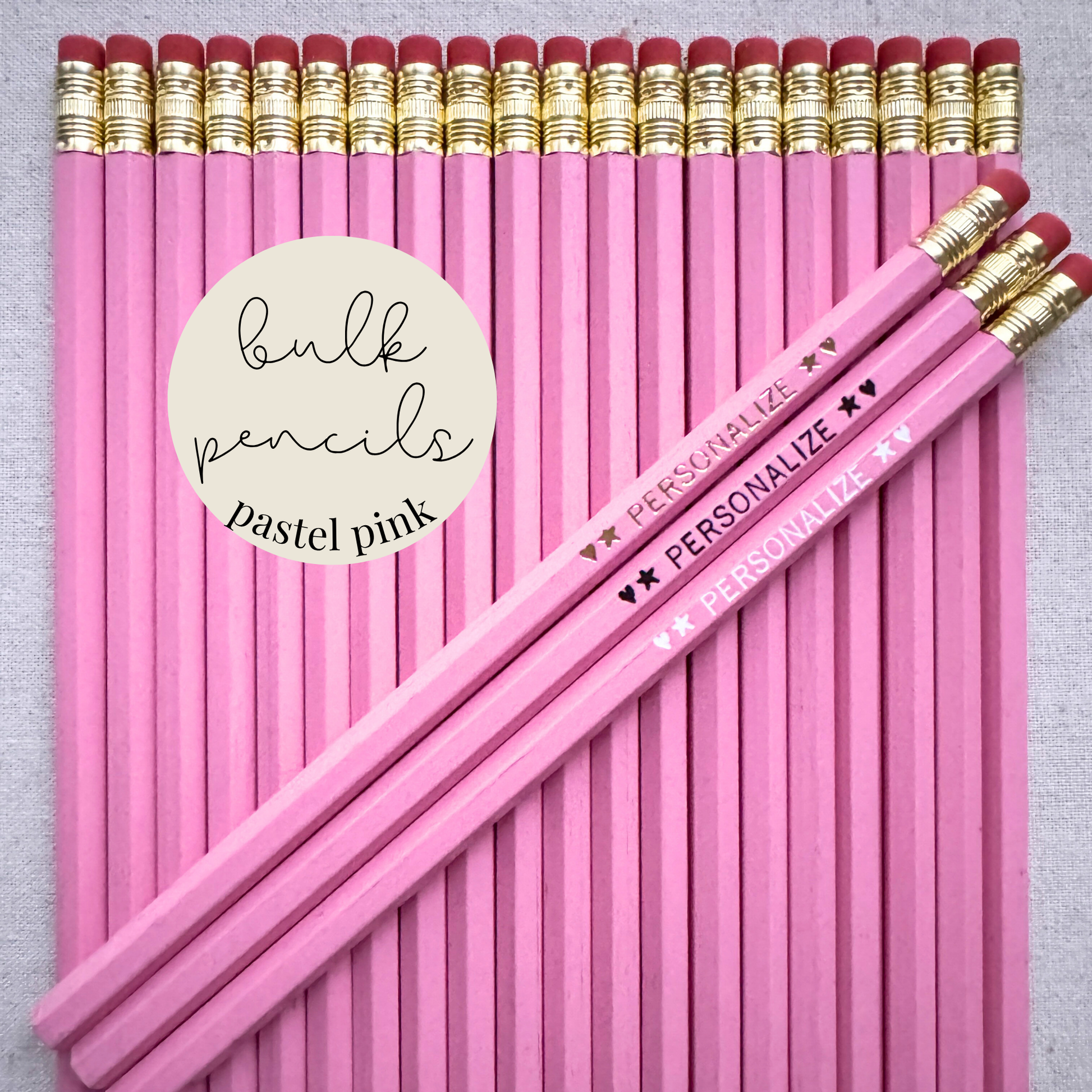 Pastel pink bulk personalized pencils flat lay in a box with custom text hand-pressed made in the USA for schools events and corporate orders
