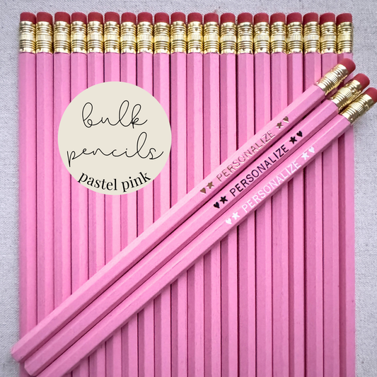 Pastel pink bulk personalized pencils flat lay in a box with custom text hand-pressed made in the USA for schools events and corporate orders