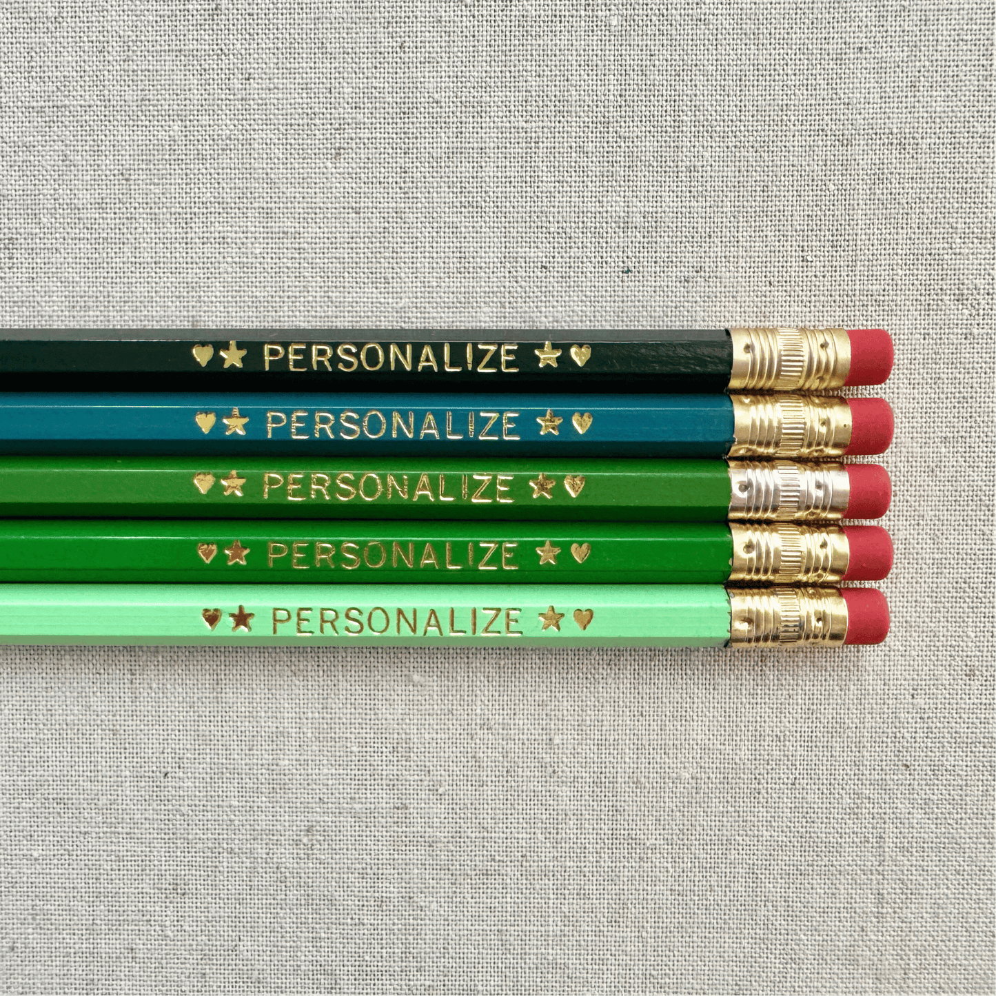 Personalized ombre green pencil set flat lay with custom text hand-pressed made in the USA back to school gift for kids