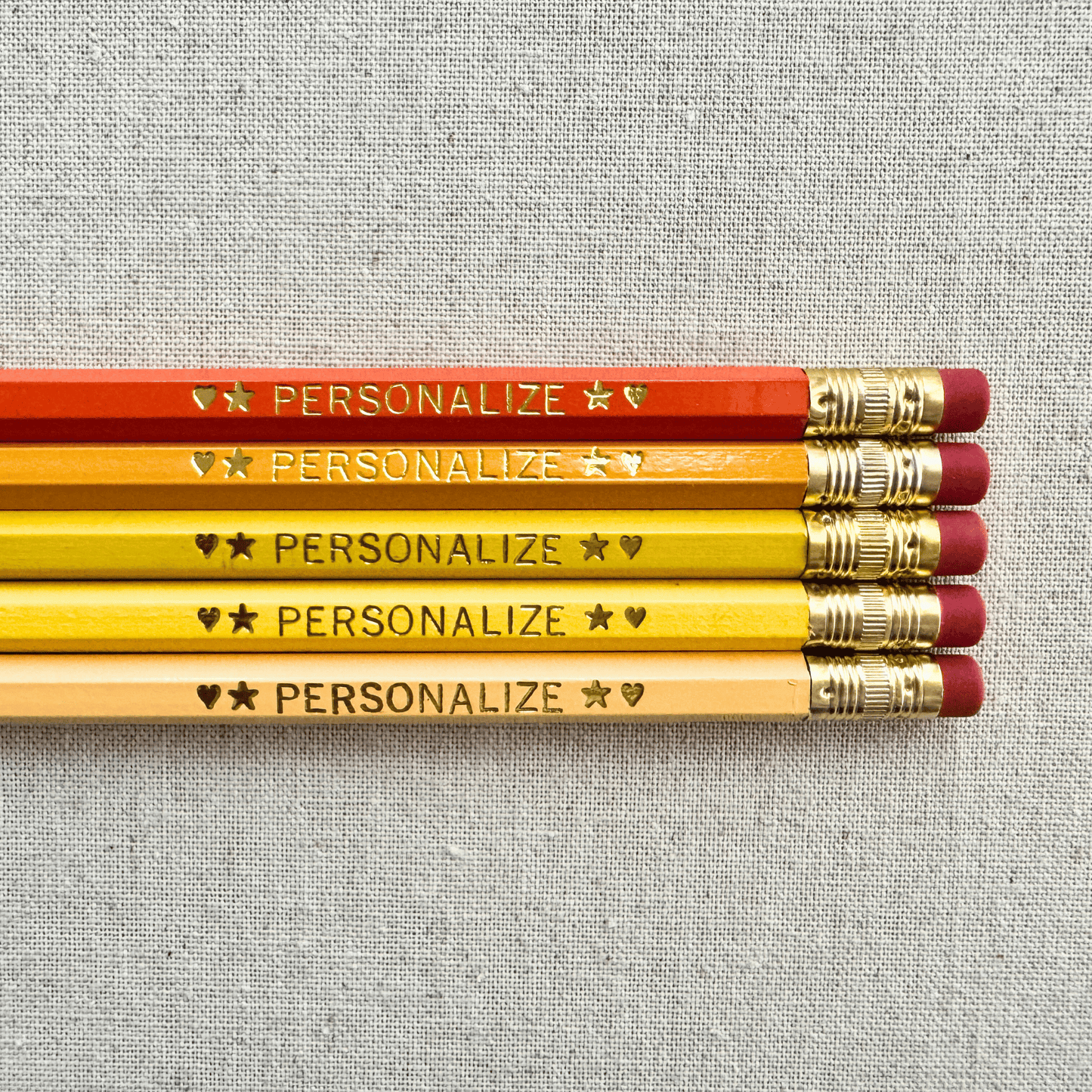 Personalized ombre orange pencil set flat lay with custom text hand-pressed made in the USA stocking stuffer gift for kids