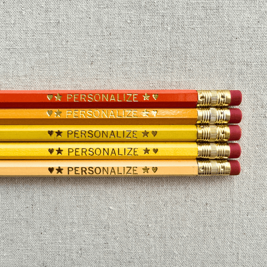 Personalized ombre orange pencil set flat lay with custom text hand-pressed made in the USA stocking stuffer gift for kids
