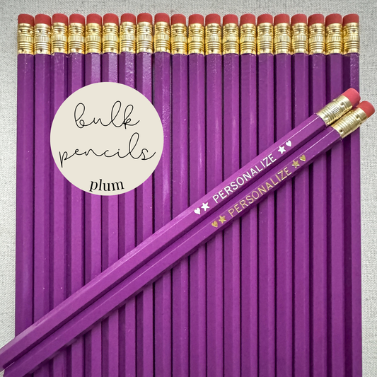 Plum bulk personalized pencils flat lay in a box with custom text hand-pressed made in the USA for schools events and corporate orders
