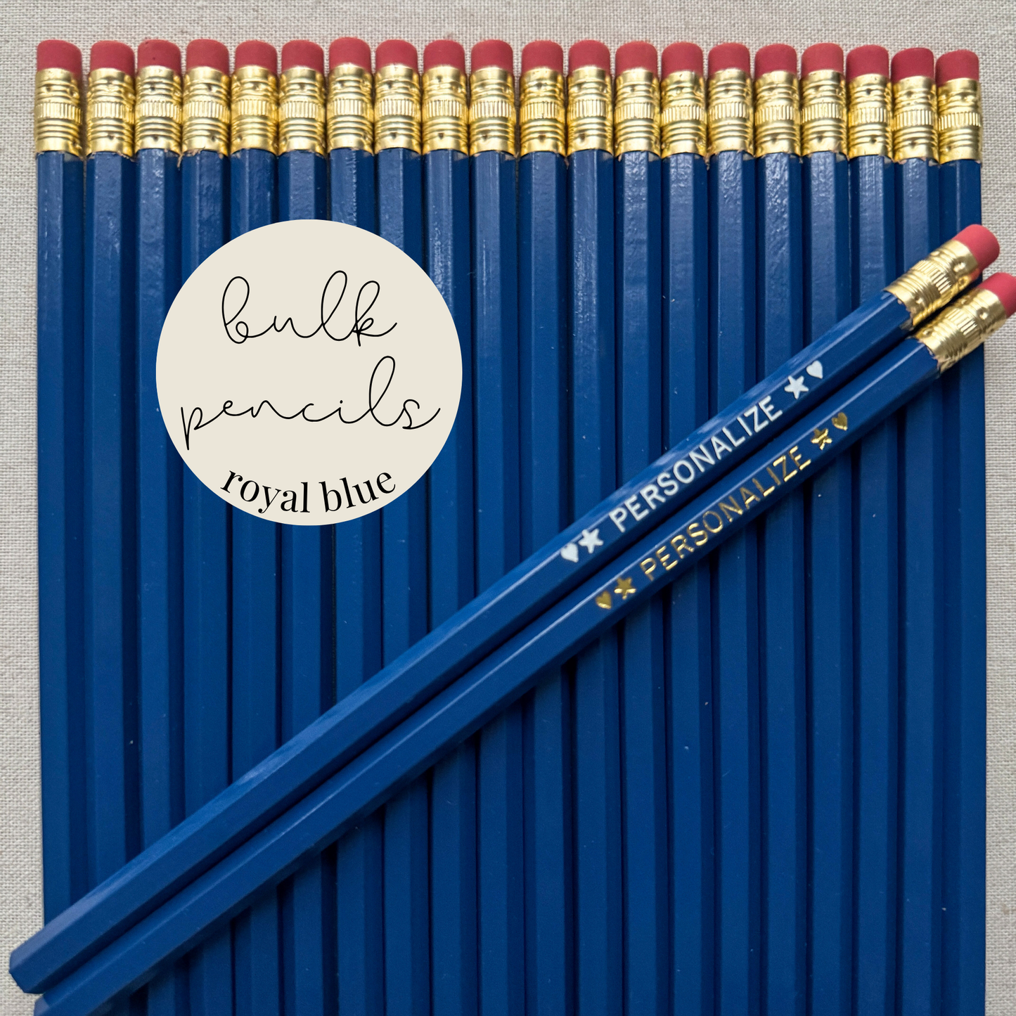 Royal blue bulk personalized pencils flat lay in a box with custom text hand-pressed made in the USA for schools events and corporate orders