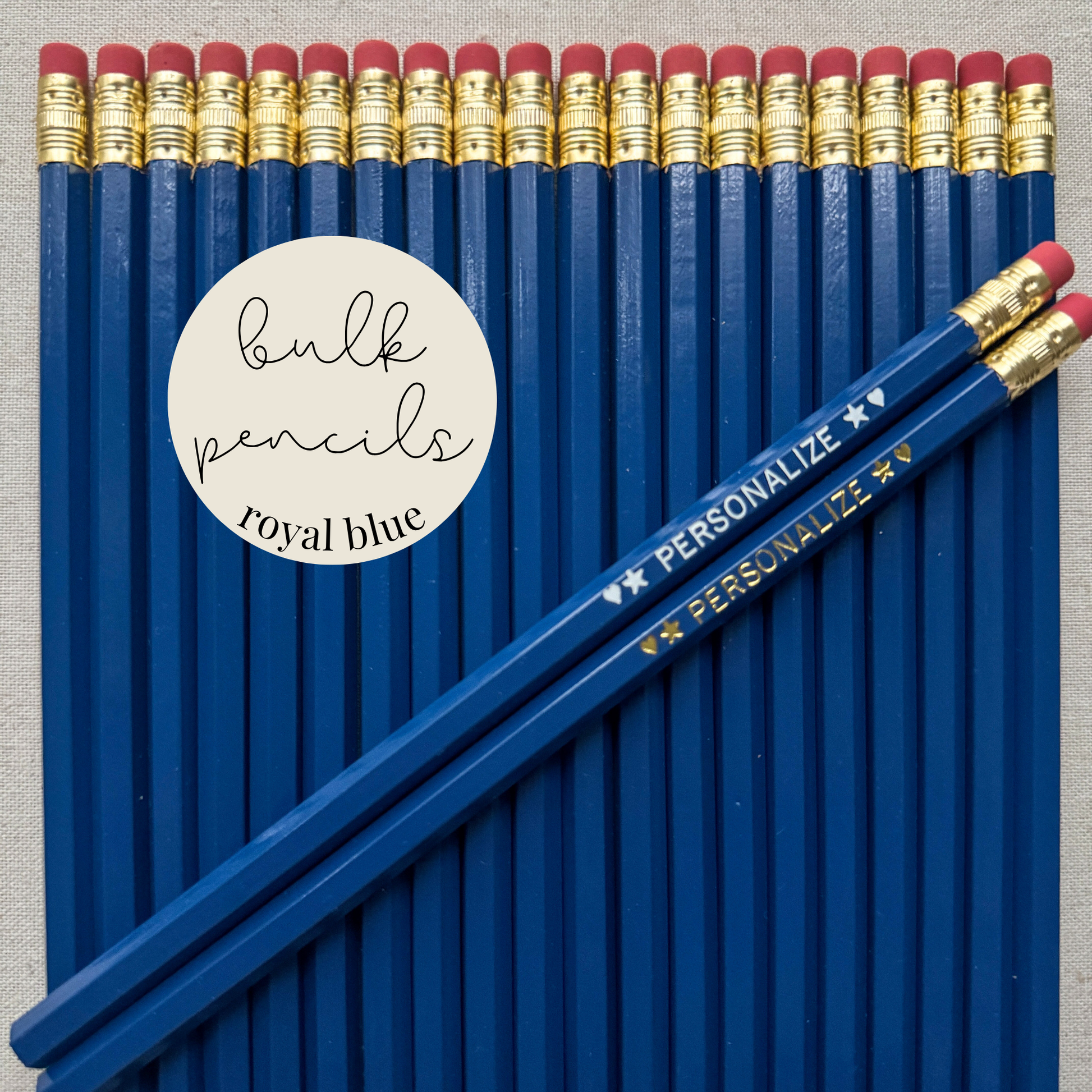 Royal blue bulk personalized pencils flat lay in a box with custom text hand-pressed made in the USA for schools events and corporate orders