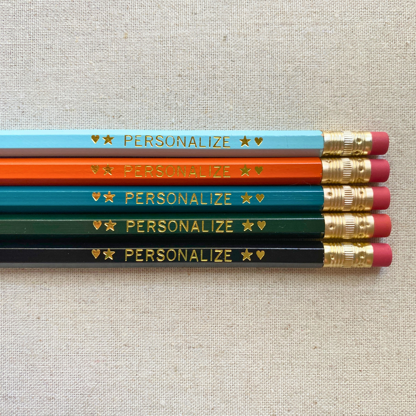 Set of 5 personalized urban edge pencil set flat lay with custom text hand-pressed made in the USA corporate gift.