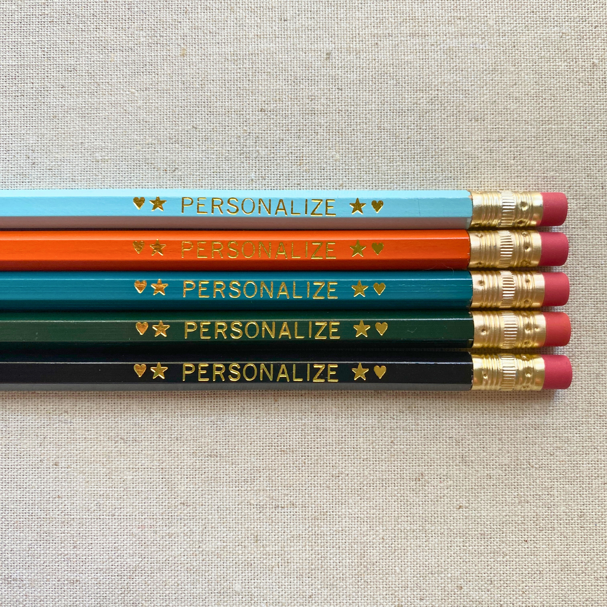 Set of 5 personalized urban edge pencil set flat lay with custom text hand-pressed made in the USA corporate gift.
