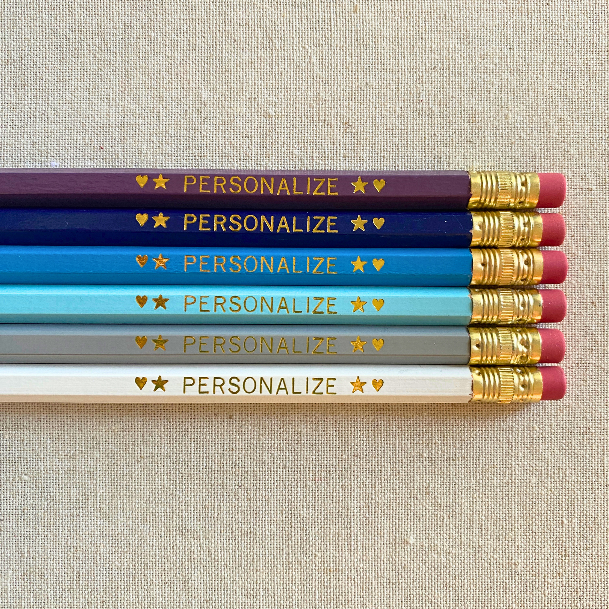 Set of 6 personalized London sky blue pencil set flat lay with custom text hand-pressed made in the USA gift for kids who love travel