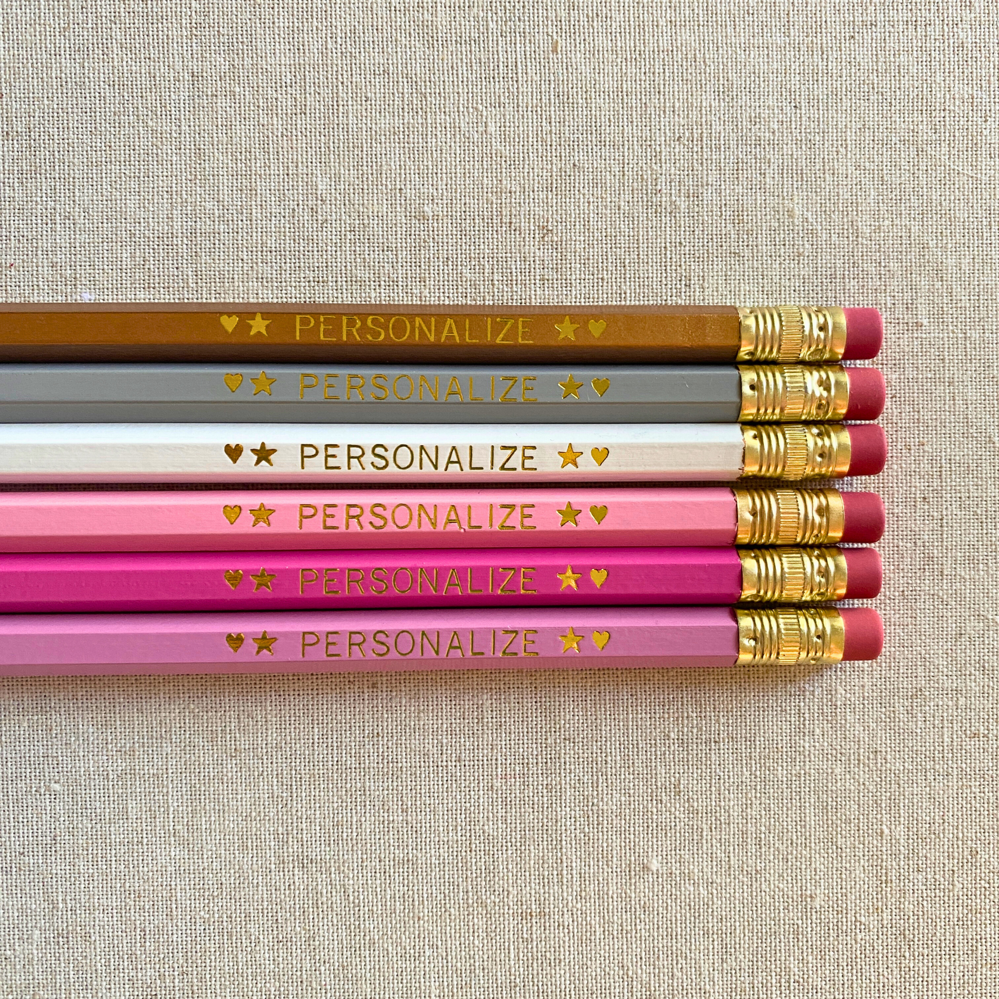 Set of 6 personalized pink champagne pencil set flat lay with custom text hand-pressed made in the USA teacher appreciation gift