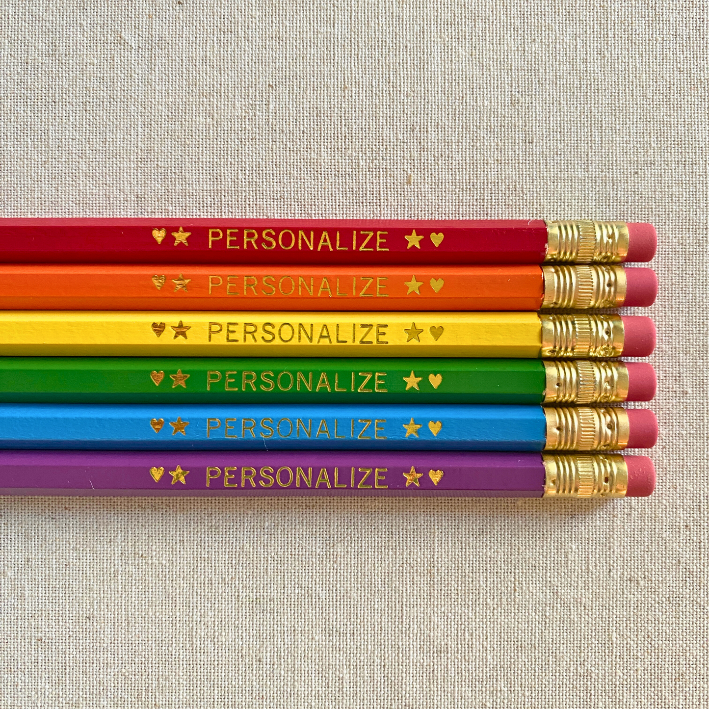 Set of 6 personalized rainbow pencil set flat lay with custom text hand-pressed made in the USA stocking stuffer for kids