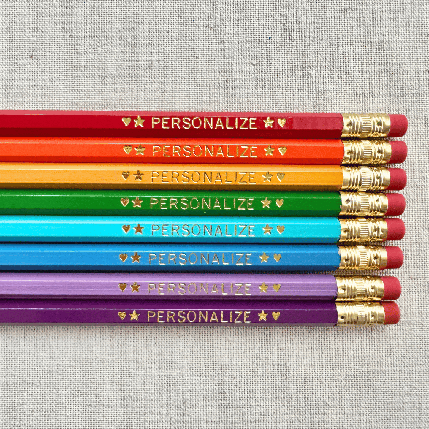 Set of 8 personalized reading rainbow pencil set flat lay with custom text hand-pressed made in the USA gift for kids who love reading