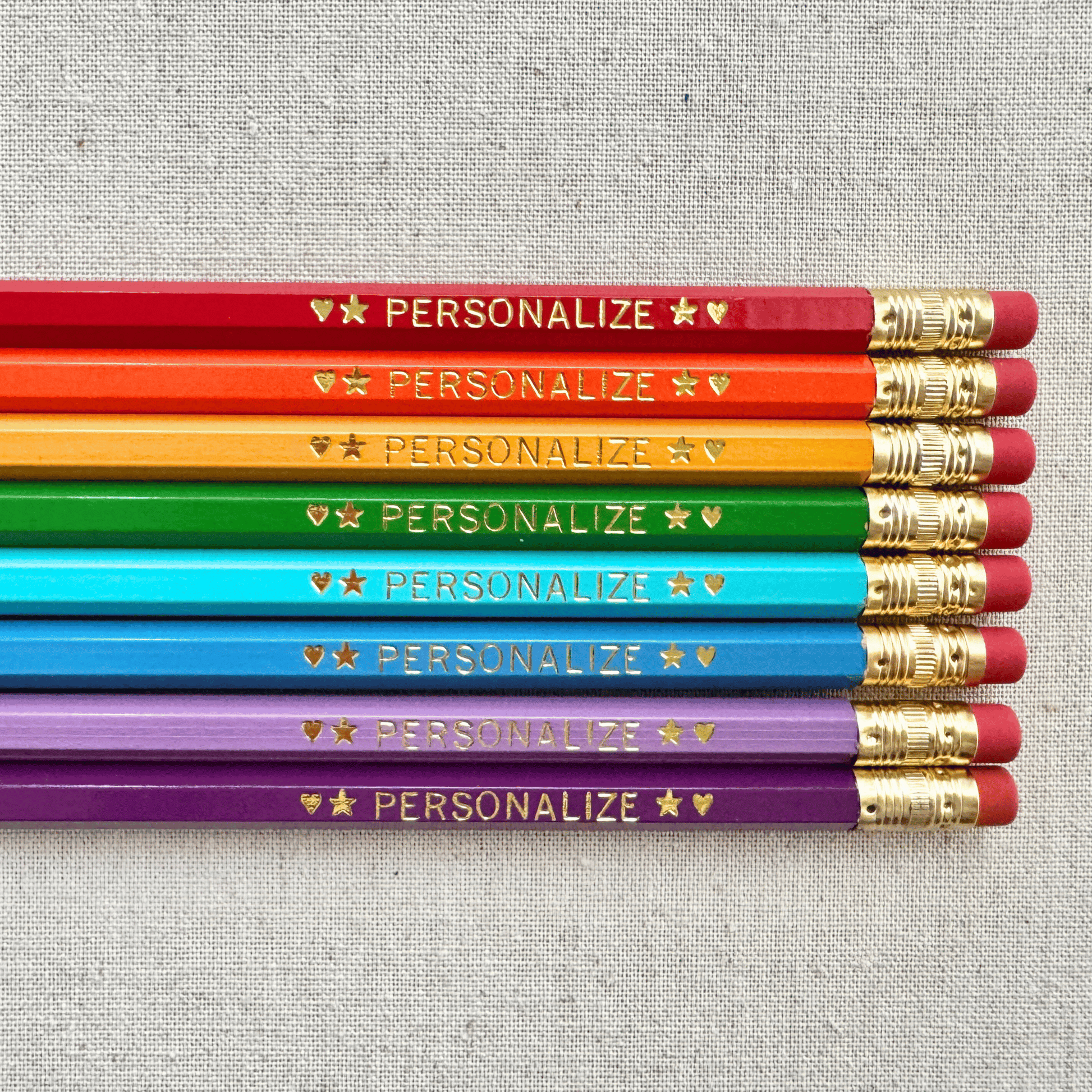 Set of 8 personalized reading rainbow pencil set flat lay with custom text hand-pressed made in the USA gift for kids who love reading
