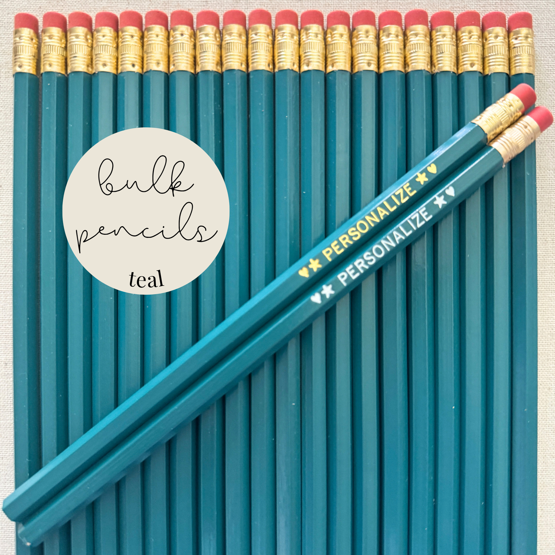 Teal bulk personalized pencils flat lay in a box with custom text hand-pressed made in the USA for schools events and corporate orders