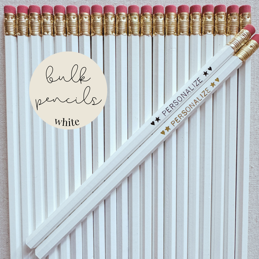 White bulk personalized pencils flat lay in a box with custom text hand-pressed made in the USA for schools events and corporate orders